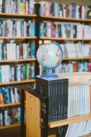 Photo Of Globe On Top Of Books picture