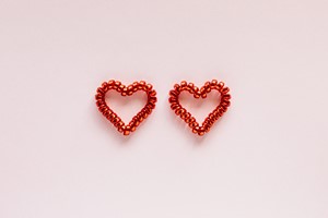 Set of colorful hearts on pink background picture